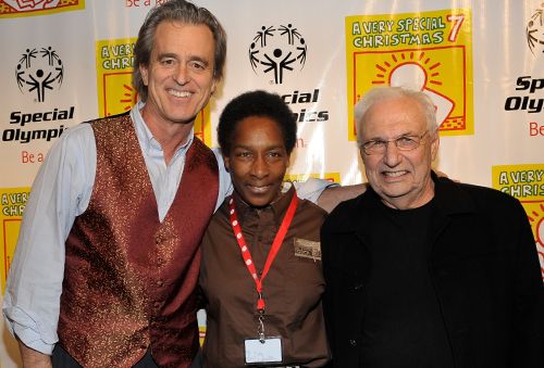 Loretta with Bobby Shriver and another guest at a Special Olympics A Very Special Christmas event