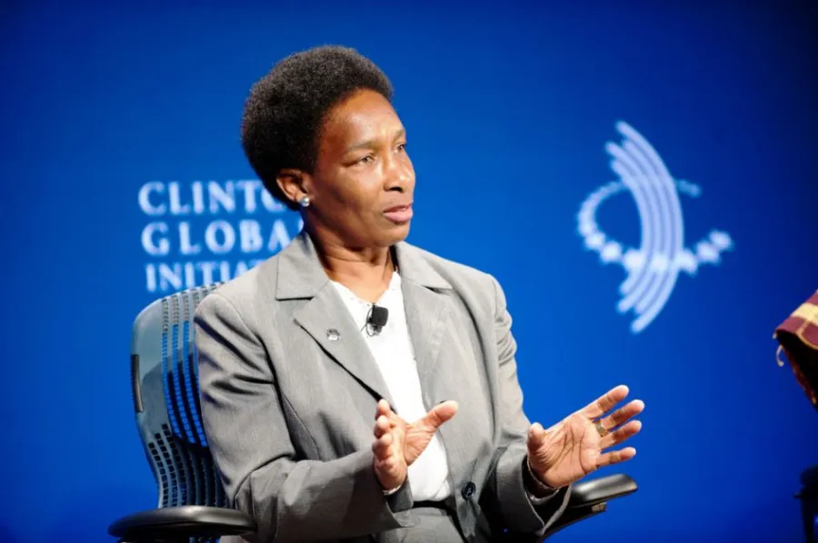 Loretta speaking on stage at the Clinton Global Initiative