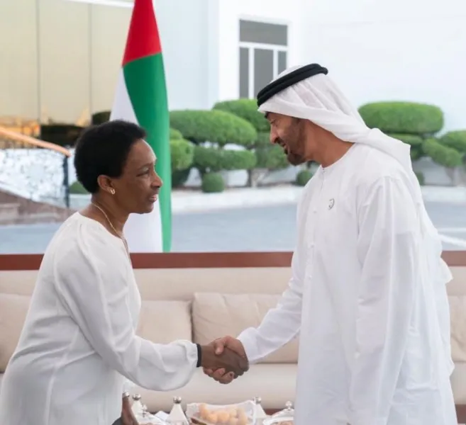 Loretta shaking hands with the Crown Prince of Abu Dhabi