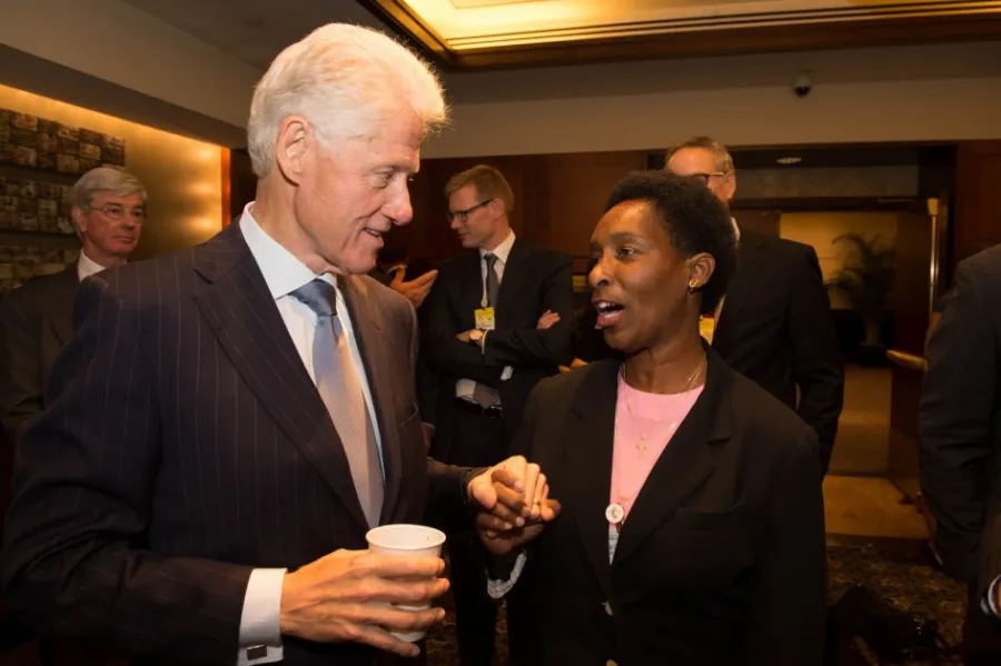 Loretta in conversation with President Bill Clinton in 2012
