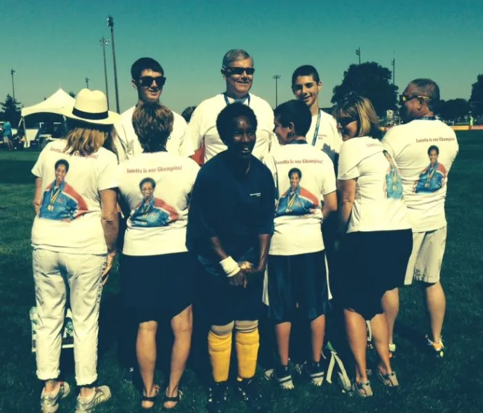 Loretta with her fan club, whose matching T-shirts carry her picture